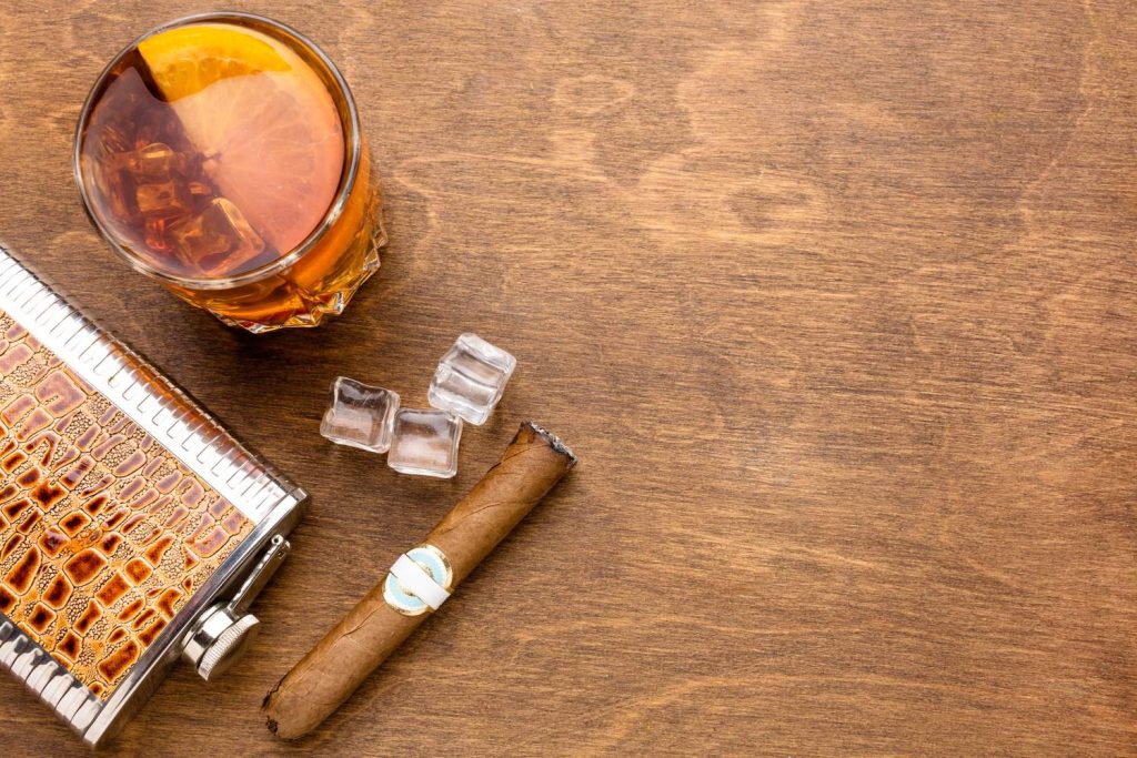Top view photo of a cigar and whiskey at the premium tobacco cigar shop in Southern Plaza