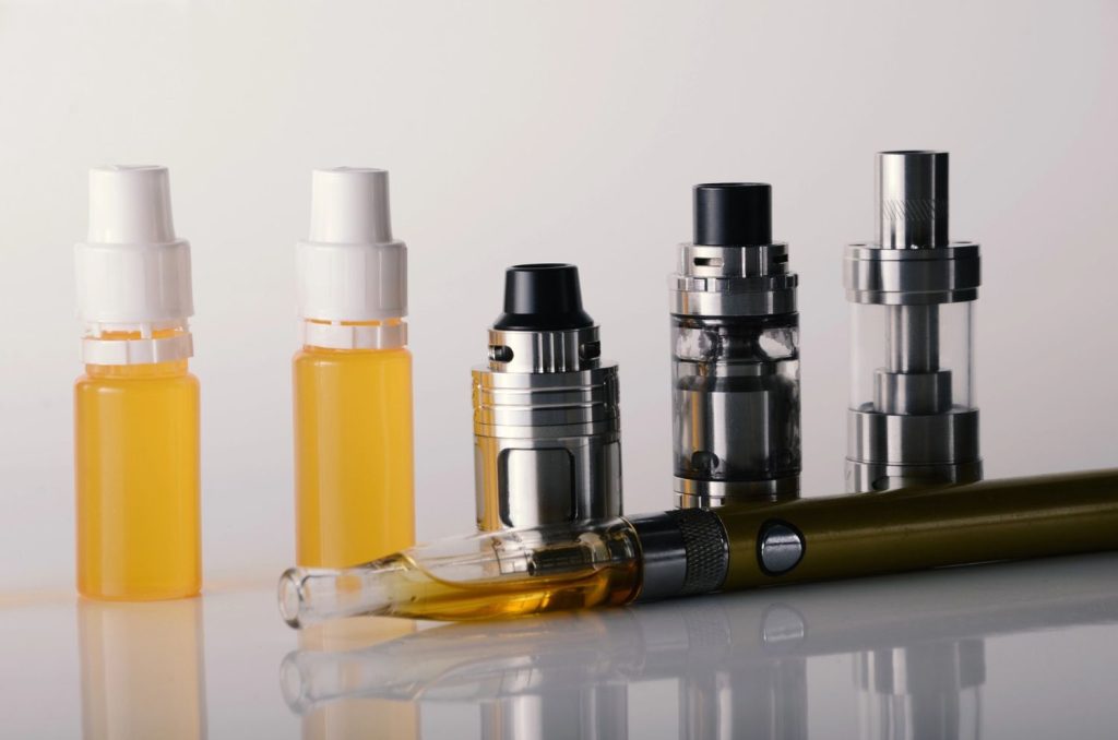 Discover a variety of vapes and e-juice bottles at a modern head shop Tulsa, showcasing quality smoking products.