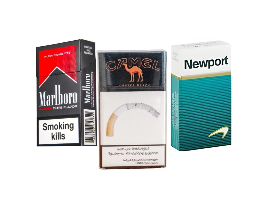 Variety of cigarette packs including Marlboro, Camel, and Newport at a cigarette shop Tulsa, showcasing popular brands and flavors.