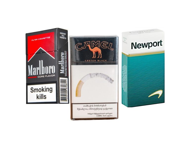 Variety of cigarette packs including Marlboro, Camel, and Newport at a cigarette shop Tulsa, showcasing popular brands and flavors.