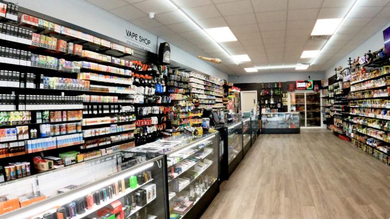 Explore a vibrant head shop Tulsa with shelves stocked with vapes, e-liquids, and smoking accessories in a well-lit store.