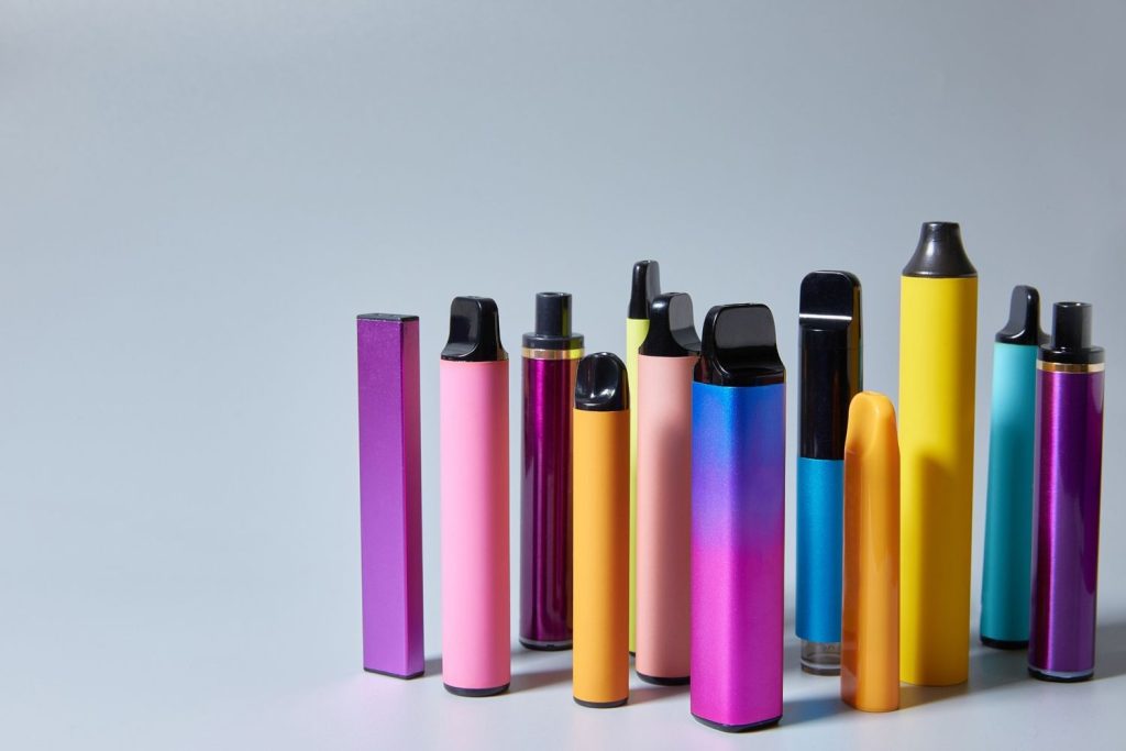 A colorful display of many disposable vape pens available at the top vape shop tulsa location.