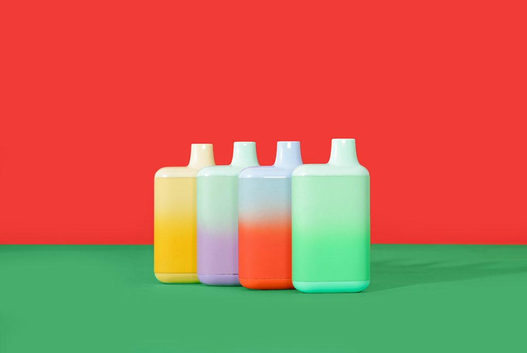 A group of colorful, high-capacity disposable vapes standing upright, showcasing the wide variety of disposable vapes Tulsa has available.