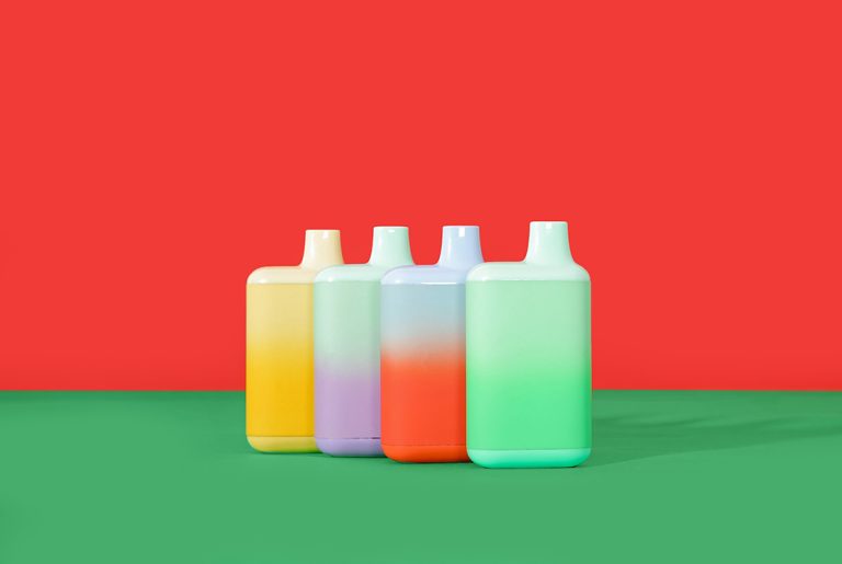 A group of colorful, high-capacity disposable vapes standing upright, showcasing the wide variety of disposable vapes Tulsa has available.