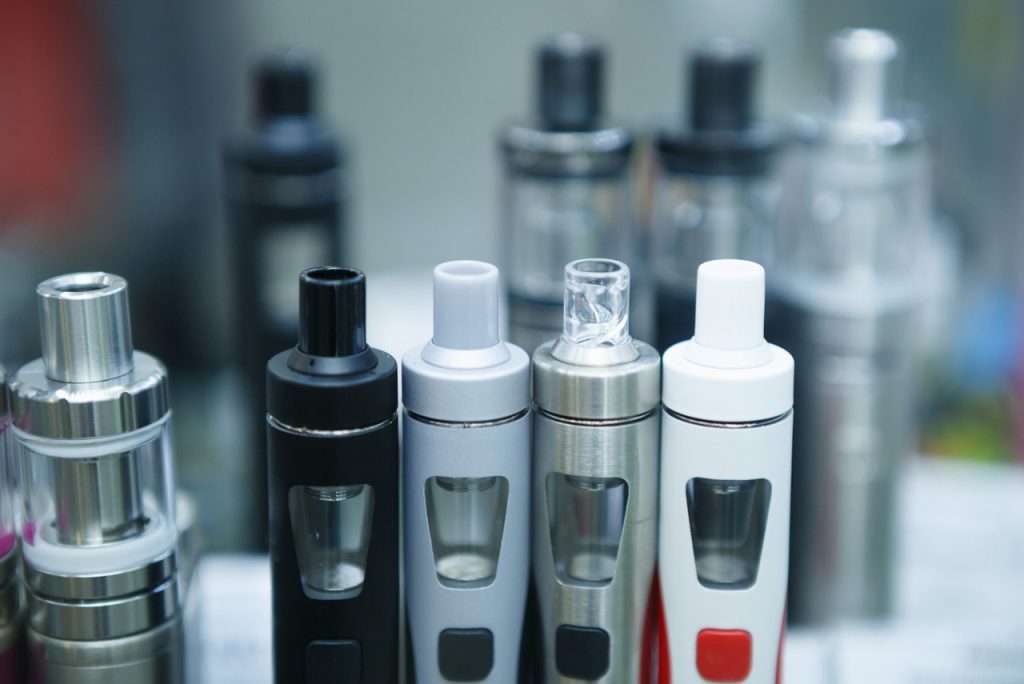 Selection of colorful vape pens and starter kits available for customers at a top-rated smoke shop Tulsa.