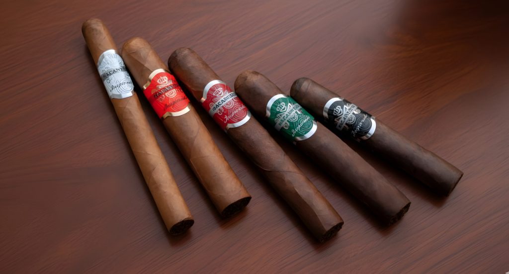 Variety of Macanudo Inspirado cigars displayed on a wood table, available at the top rated cigar store Tulsa.