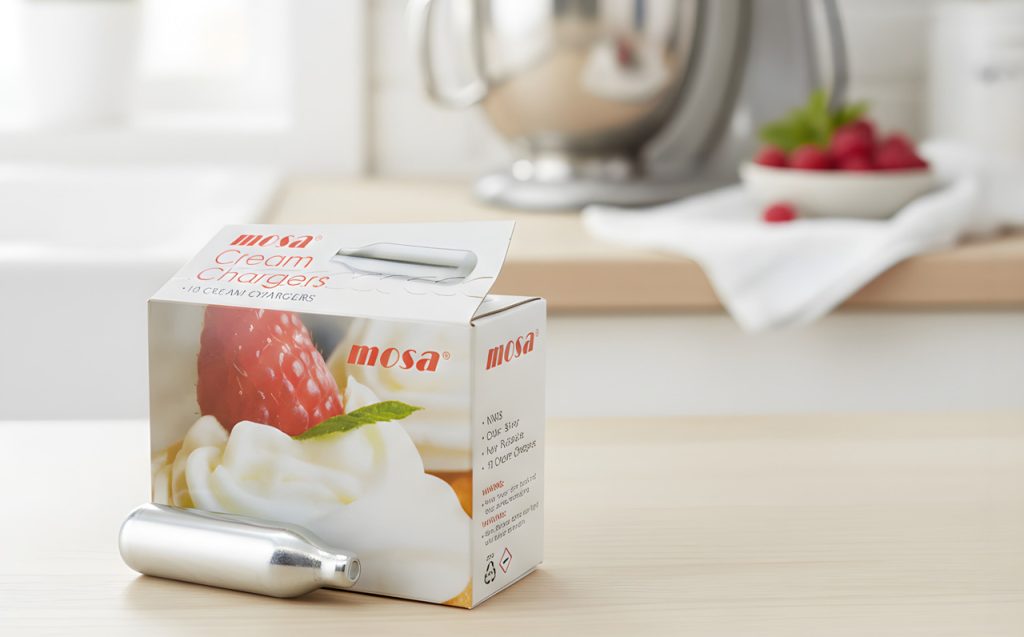 Mosa whipped cream nitrous oxide chargers Tulsa kitchen supply box with silver canister on a modern wooden countertop.