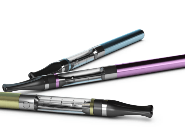 Three colorful vape pens in blue pink and gold showcasing a variety of e-cigarettes Tulsa styles on a white background.