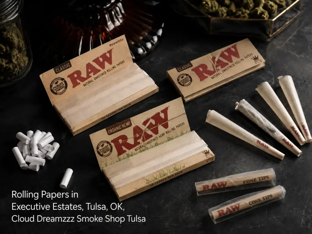RAW classic and organic hemp rolling papers, cones, and filter tips on a dark counter for rolling papers Tulsa blogs. 
