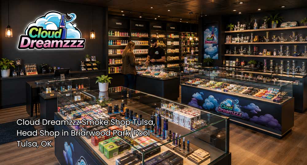 Head shop Tulsa showroom with a customer and employee beside illuminated glass counters filled with vapes and accessories.